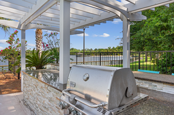 outdoor grilling area under pergola
